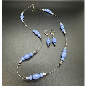 Vintage costume jewelry set featuring light blue and white beads